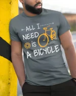 All I Need Is A Bicycle T-Shirt Casual Bike Rider - model in grey shirt leaning against column