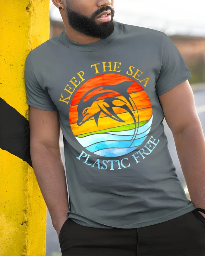 Keep The Sea Plastic Free Dolphin T-Shirt Eco Graphic - model in grey shirt leaning against column