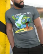 Earth Day On T-Shirt Eco Friendly Solar Tree Graphic - model in grey shirt leaning against column