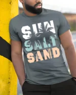 Sun Salt Sand T-Shirt Retro Summer Beach Vibe Tee - model in grey shirt leaning against column