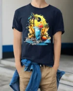 Relax on Beach T-Shirt with Palm Trees and Summer Drink - model wearing navy shirt, hands in pockets