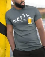 Funny Friday Beer Evolution T-Shirt for Weekend Lovers - model in grey shirt leaning against column