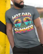 Hot Dad Summer T-Shirt Funny Retro Beach Dad - model in grey shirt leaning against column