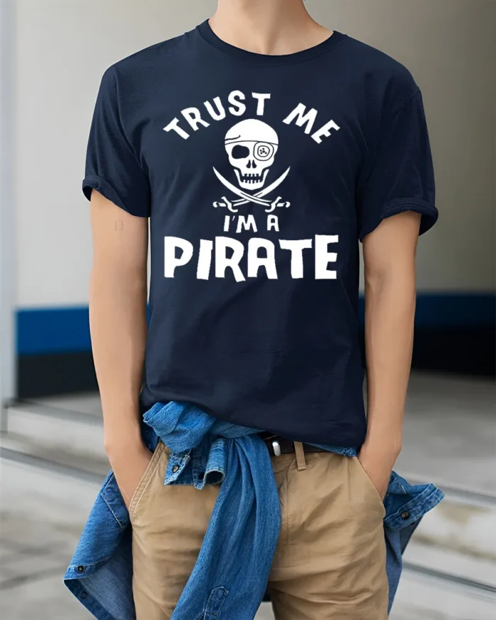 Adventure Seeker Trust Me I’m A Pirate T-Shirt - model wearing navy shirt, hands in pockets