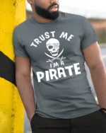 Adventure Seeker Trust Me I’m A Pirate T-Shirt - model in grey shirt leaning against column