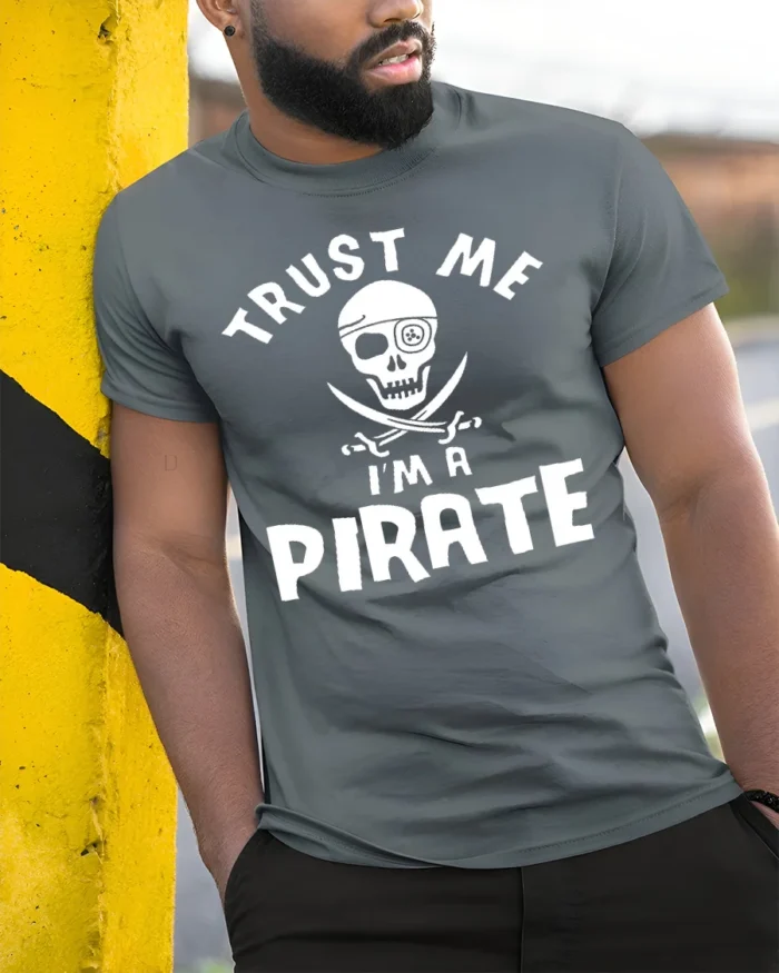 Adventure Seeker Trust Me I’m A Pirate T-Shirt - model in grey shirt leaning against column