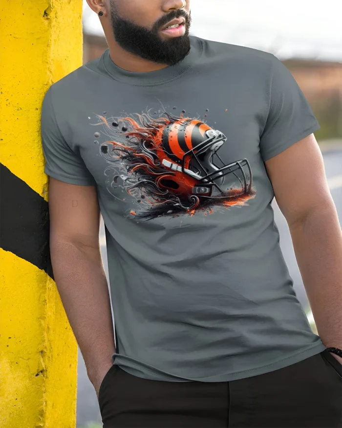 Fierce Football Helmet Flame T-Shirt Dynamic Art - model in grey shirt leaning against column