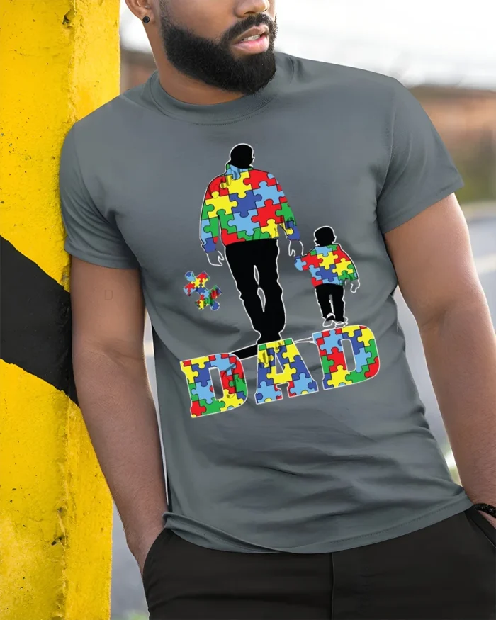 Father and Child Puzzle T-Shirt Colorful Dad - model in grey shirt leaning against column