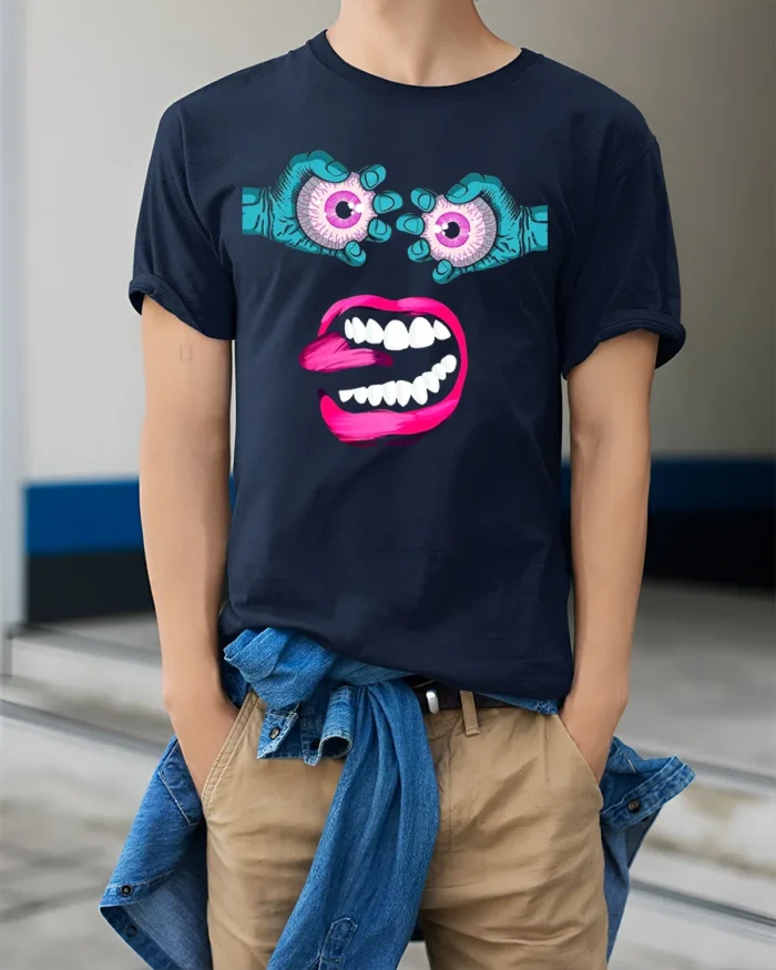 Surreal Monster Face Tee Trippy Eyeball Mouth Graphic - model wearing navy shirt, hands in pockets