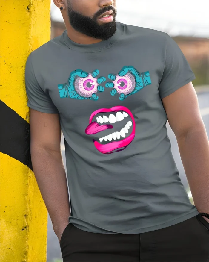 Surreal Monster Face Tee Trippy Eyeball Mouth Graphic - model in grey shirt leaning against column