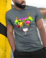 Rainbow Skull Heart Tee Vibrant Skull Sunglasses T-Shirt - model in grey shirt leaning against column