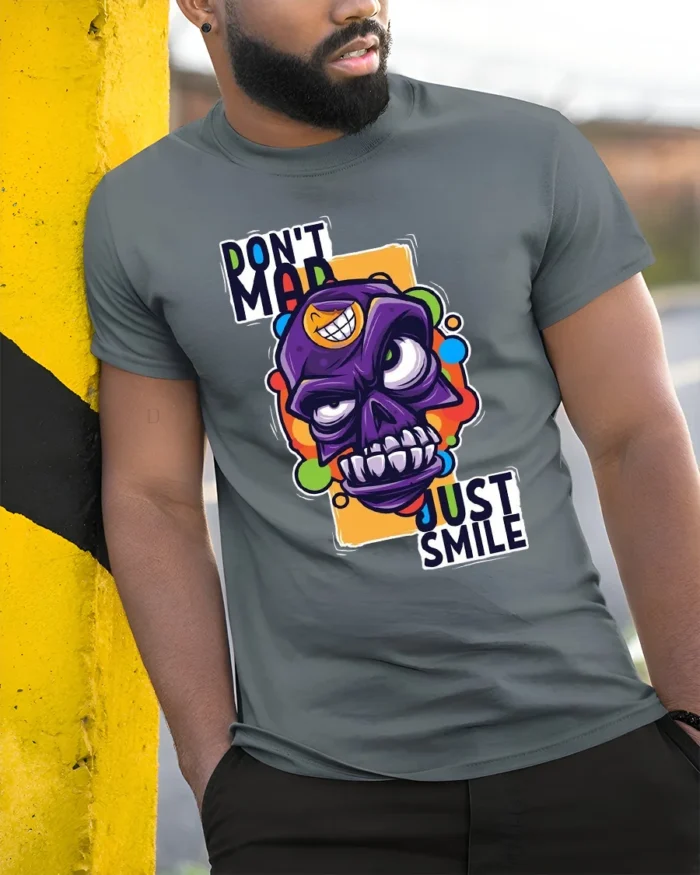 Colorful Angry Skull T-Shirt, Don’t Mad Just Smile Tee - model in grey shirt leaning against column