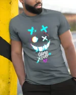 Game Over Smiley Tee Distressed Gamer Graphic T-Shirt - model in grey shirt leaning against column