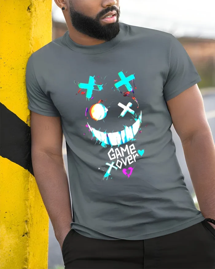 Game Over Smiley Tee Distressed Gamer Graphic T-Shirt - model in grey shirt leaning against column