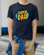 Superhero Dad T-Shirt Funny Father’s Day Tee Now - model wearing navy shirt, hands in pockets