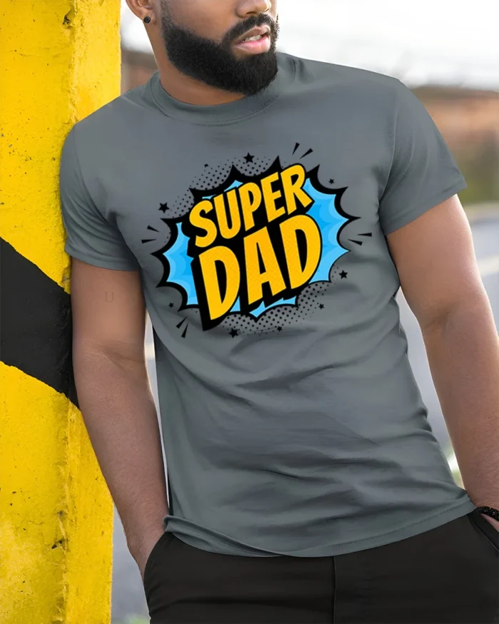 Superhero Dad T-Shirt Funny Father’s Day Tee Now - model in grey shirt leaning against column