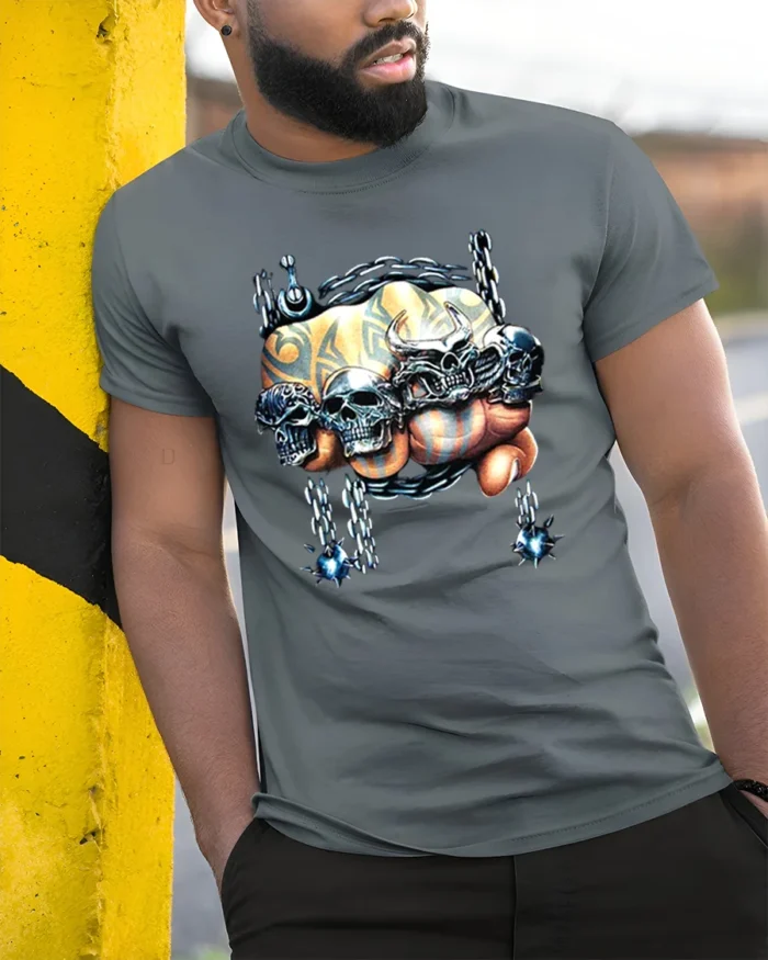 Skull Crusher Fist Metal Rock Graphic T-Shirt - model in grey shirt leaning against column