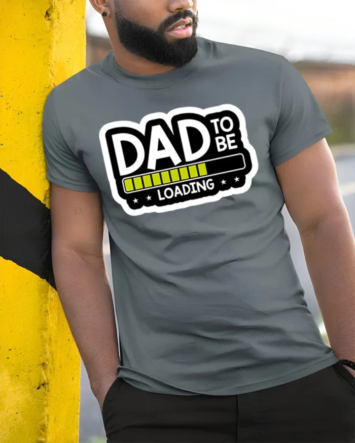 Dad To Be Loading Funny Expecting Father T-Shirt - model in grey shirt leaning against column