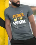 Father of the Year Tee Best Dad Award T-Shirt Gift - model in grey shirt leaning against column
