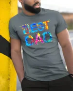 Best Dad Splatter Colorful Father’s Day T-Shirt - model in grey shirt leaning against column