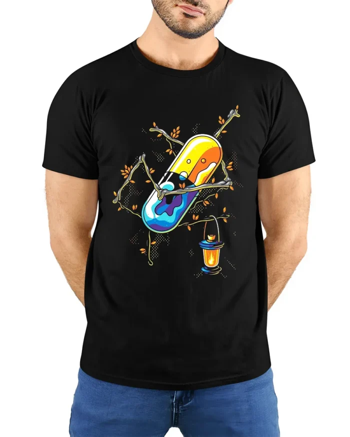 Enchanted Pill T-Shirt Whimsical Capsule Lantern - model wearing black shirt, hands behind back