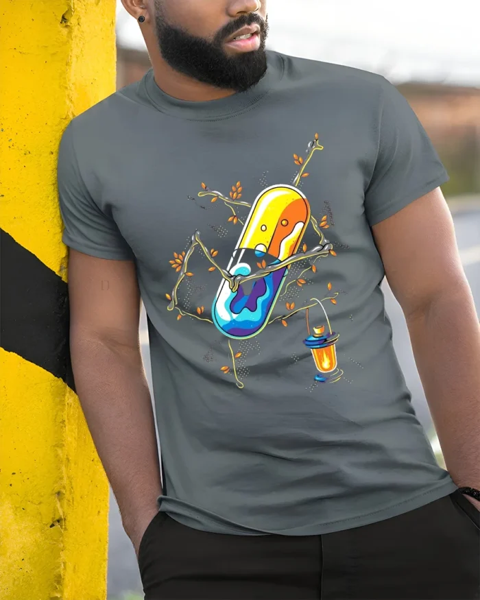Enchanted Pill T-Shirt Whimsical Capsule Lantern - model in grey shirt leaning against column