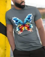 Smoke Butterfly Colorful Abstract Art T-Shirt - model in grey shirt leaning against column
