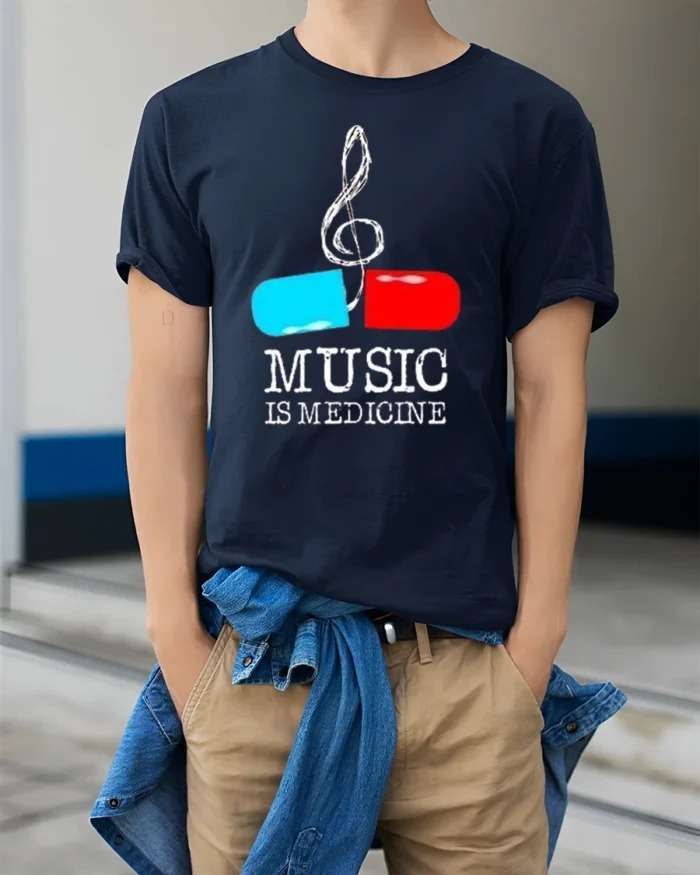 Music Is Medicine T-shirt with Pill and Treble Note Art - model wearing navy shirt, hands in pockets