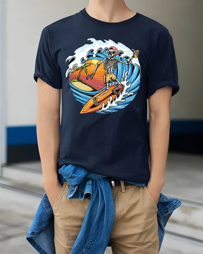 Skeleton Surfing Sunset T-shirt with Beach and Wave Art - model wearing navy shirt, hands in pockets