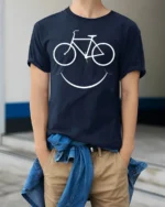 Bike Smile T-Shirt Minimalist Cycling Tee for Bikers - model wearing navy shirt, hands in pockets