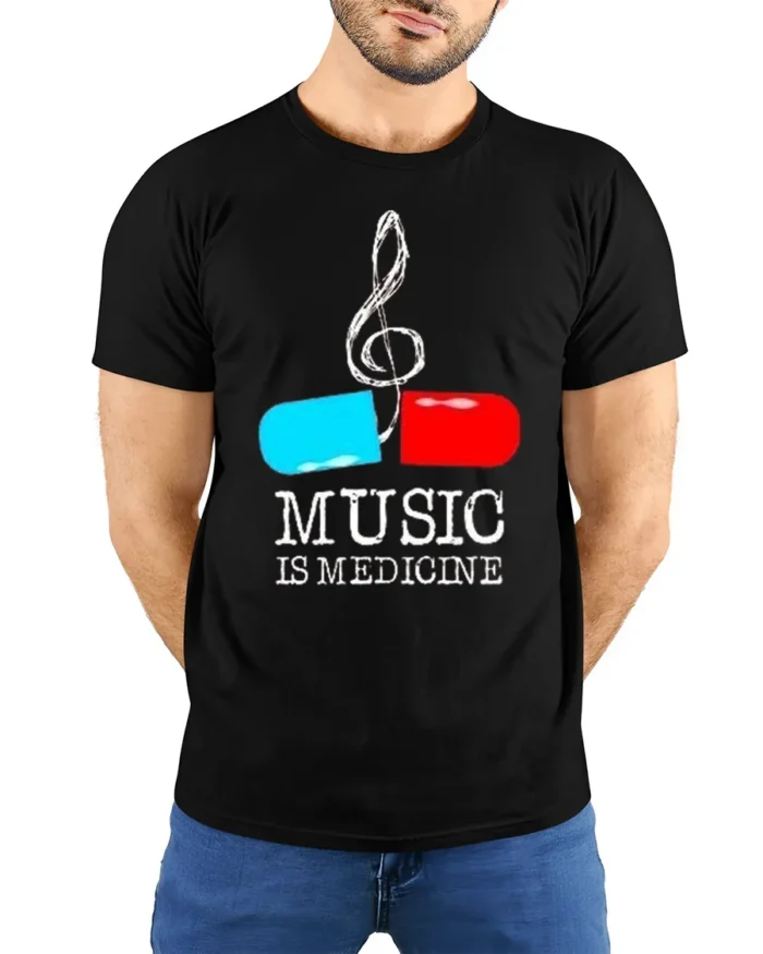 Music Is Medicine T-shirt with Pill and Treble Note Art - model wearing black shirt, hands behind back