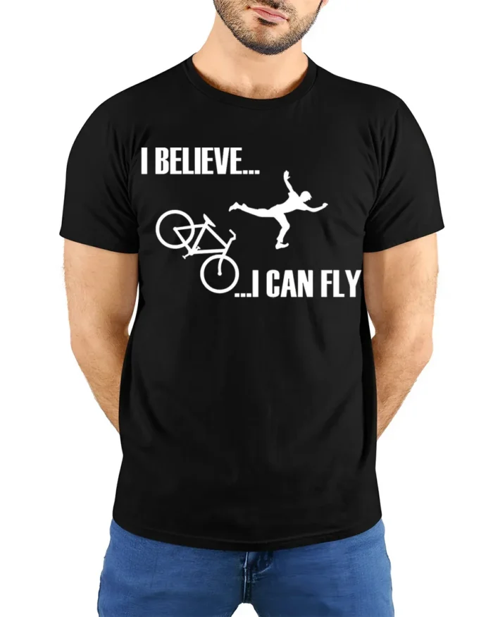 I Believe I Can Fly Funny Bike Crash T-Shirt for Cyclists - model wearing black shirt, hands behind back