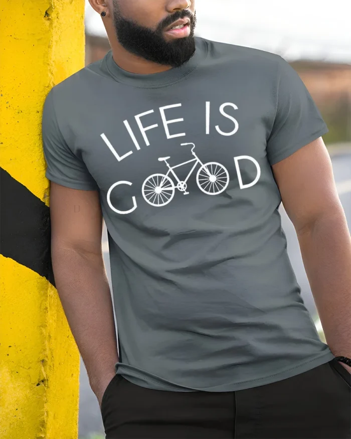 Life Is Good Bicycle Graphic T-shirt for Cycling Lovers - model in grey shirt leaning against column