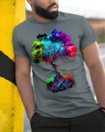 Colorful Tree of Life T-Shirt Abstract Vibrant Nature Art - model in grey shirt leaning against column