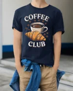 Coffee Club Croissant T-Shirt for Coffee Lovers Foodies - model wearing navy shirt, hands in pockets