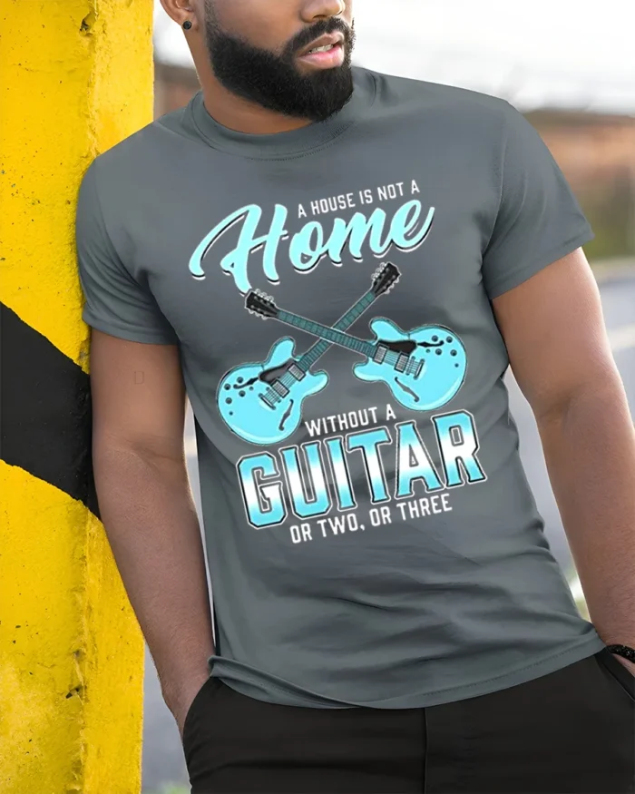 Guitar Lover T-Shirt A Home Needs Guitars Funny Quote - model in grey shirt leaning against column
