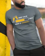 Keep Calm Beer Is Loading T-Shirt Funny Drinking - model in grey shirt leaning against column