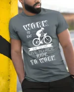 Ride to Work T-Shirt Work Eat Live Ride Cyclist - model in grey shirt leaning against column