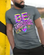 Be Yourself T-Shirt Colorful Self Love Pride Graphic - model in grey shirt leaning against column