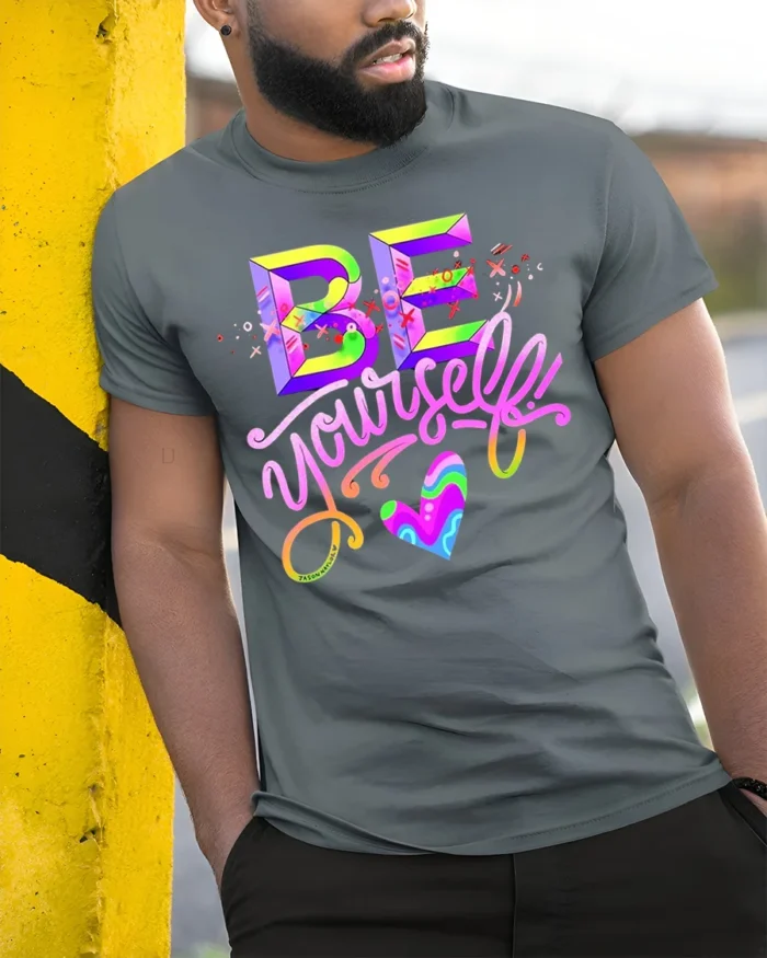 Be Yourself T-Shirt Colorful Self Love Pride Graphic - model in grey shirt leaning against column