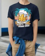Stay Calm and Drink Beer T-Shirt Funny Beach Bar - model wearing navy shirt, hands in pockets
