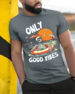 Only Good Vibes Skeleton T-Shirt Funny Beach Chill - model in grey shirt leaning against column