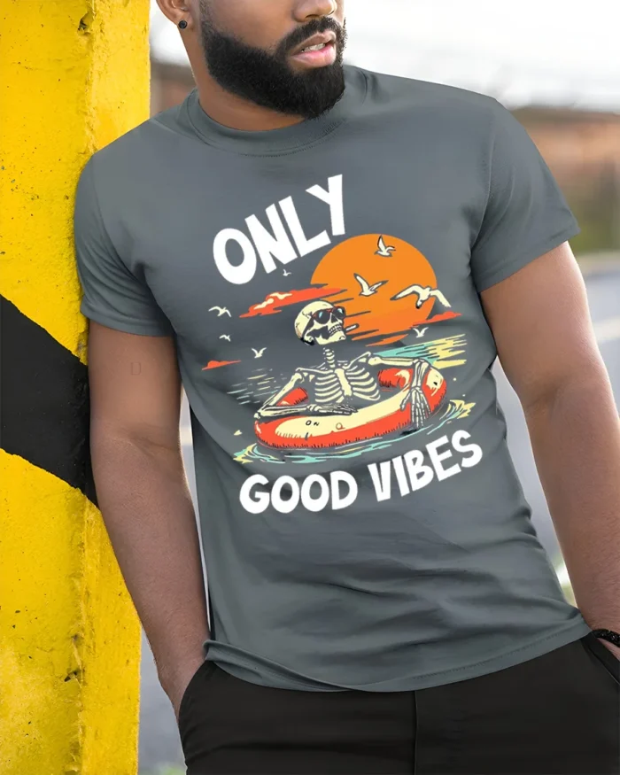 Only Good Vibes Skeleton T-Shirt Funny Beach Chill - model in grey shirt leaning against column