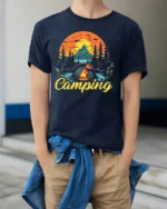 Vintage Camping T-Shirt Tent Fire Forest Mountain Sunset - model wearing navy shirt, hands in pockets