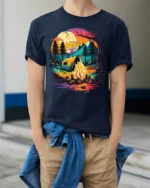 Sunset Camping T-Shirt Colorful Campfire Forest Scene - model wearing navy shirt, hands in pockets