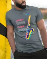 I Just Need Saxophone T-Shirt Colorful Jazz Music - model in grey shirt leaning against column