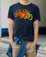 Retro Rainbow Bicycle T-Shirt Colorful Bike Rider - model wearing navy shirt, hands in pockets