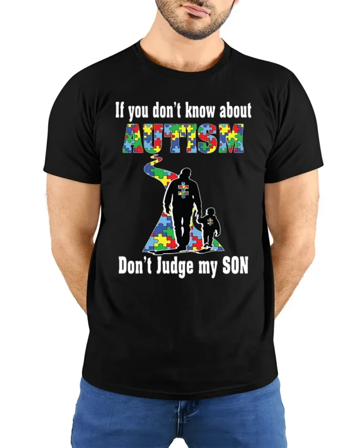 Autism Awareness T-Shirt  Don’t Judge My Son Message - model wearing black shirt, hands behind back