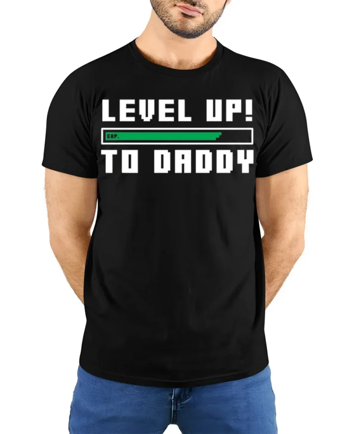Level Up to Daddy T-Shirt Funny New Dad Gamer - model wearing black shirt, hands behind back