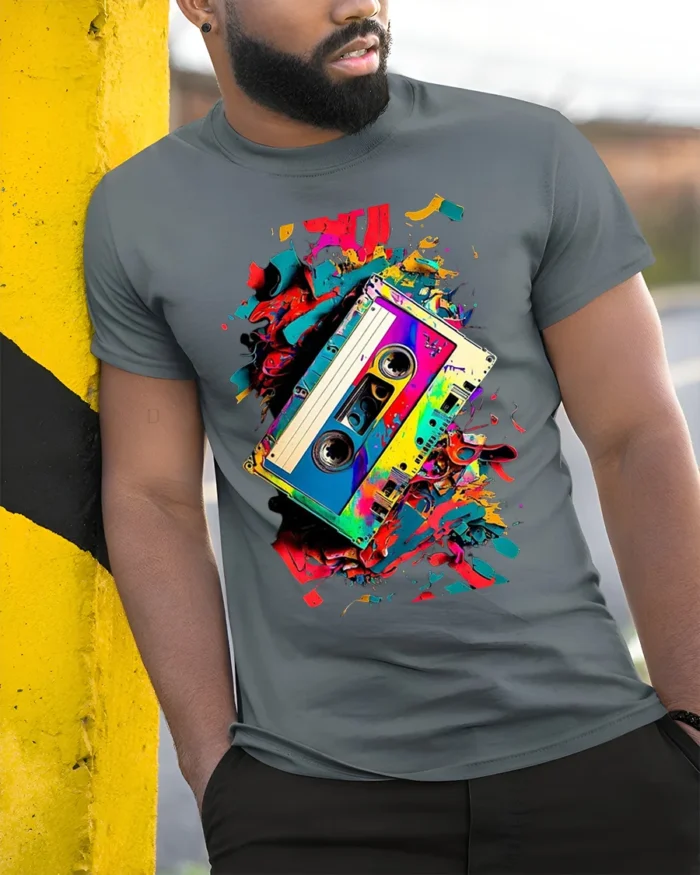 Retro Cassette Tape T-Shirt with Colorful Splash Art - model in grey shirt leaning against column